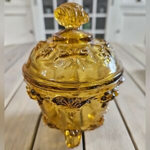 Vintage Jeannette Glass amber footed candy dish with a lid grape & vine pattern.